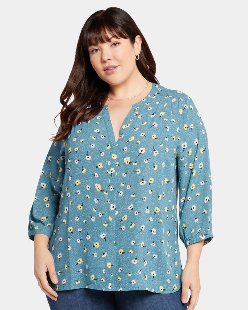 Front of a model wearing a size 4X Pintuck Blouse in Blue Vista by NYDJ. | dia_product_style_image_id:285255